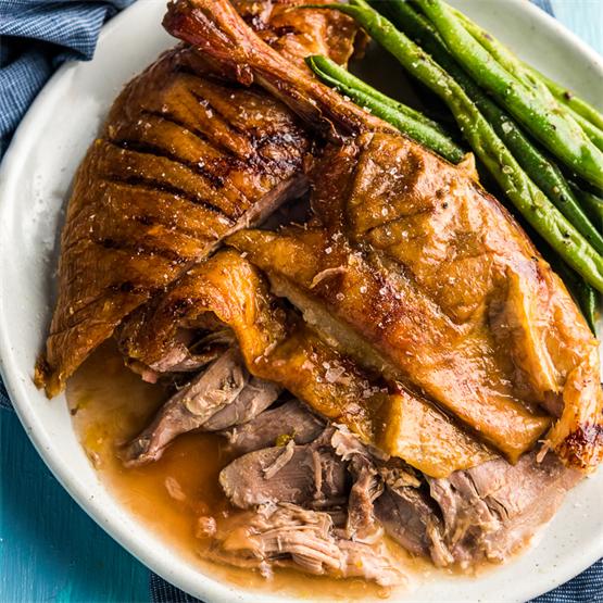 The duck is stuffed with citrus then slow cooked to perfection