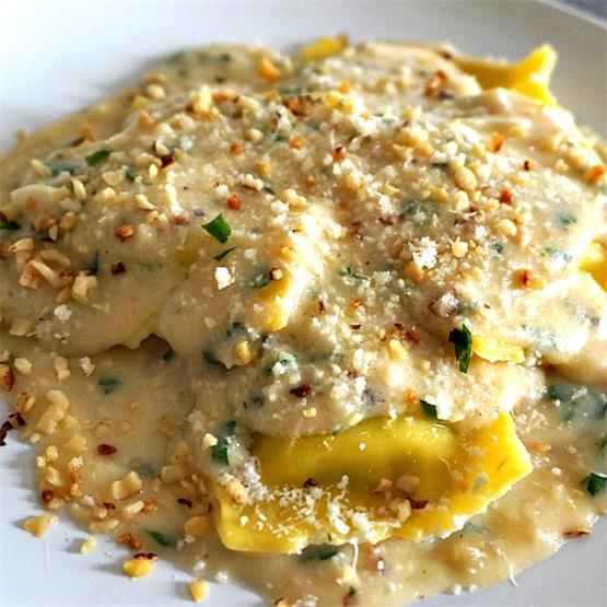 Cheese Ravioli in creamy sauce with Parmesan cheese and walnut