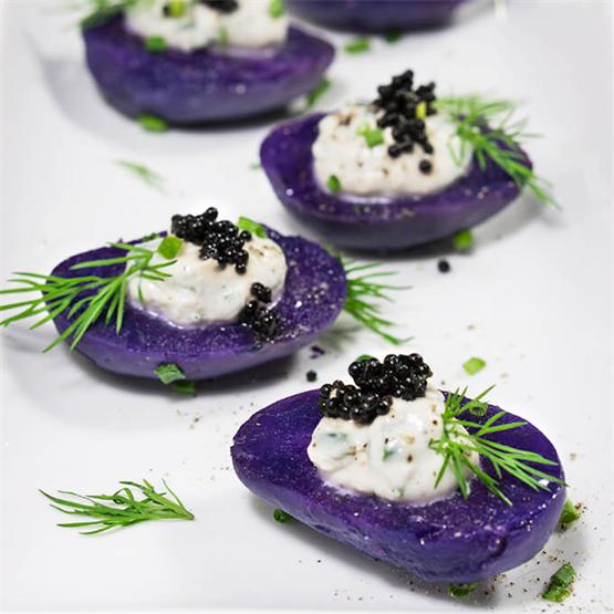 Purple potato bites with horseradish creme fraiche and caviar
