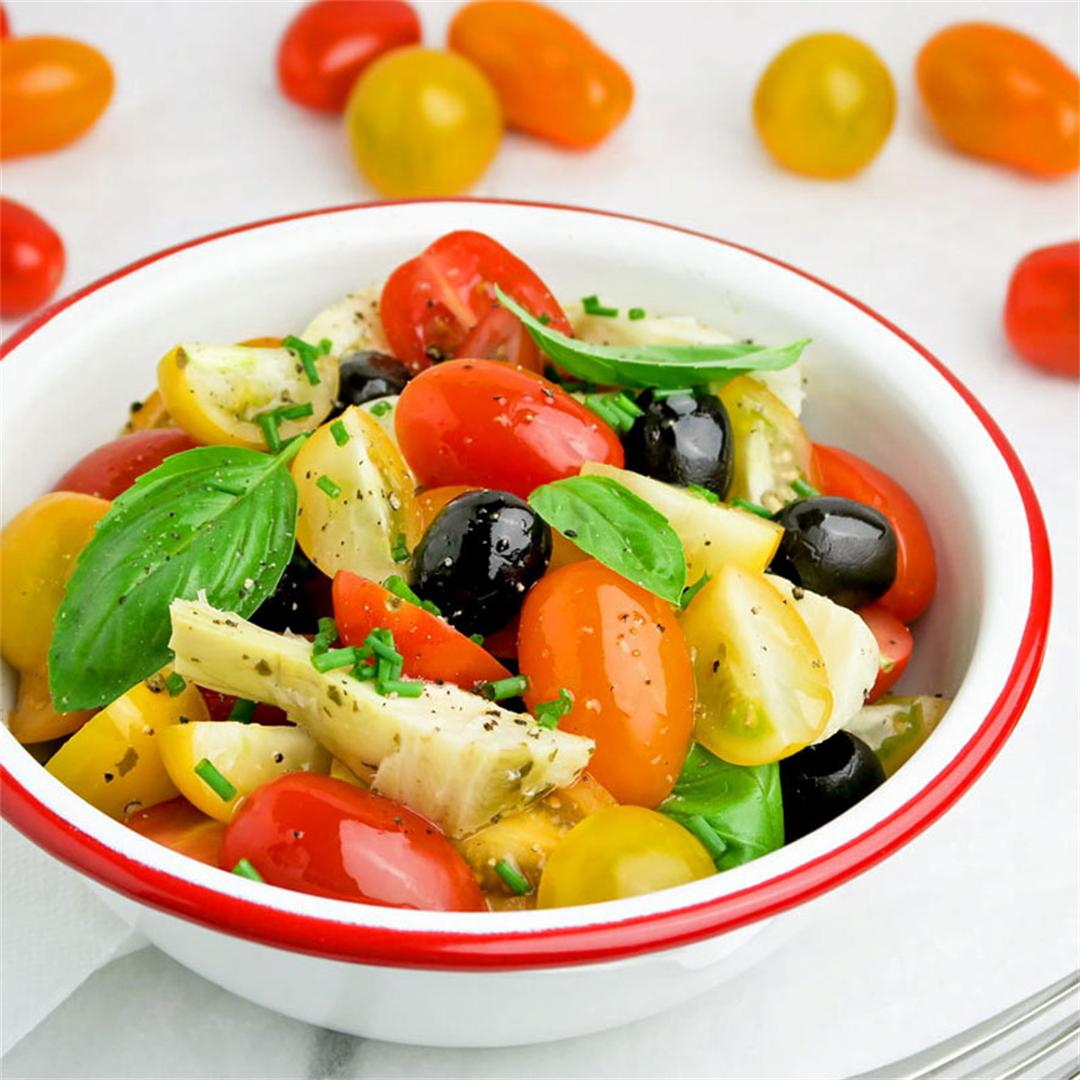 Cherry tomatoes with artichoke hearts, black olives and herbs
