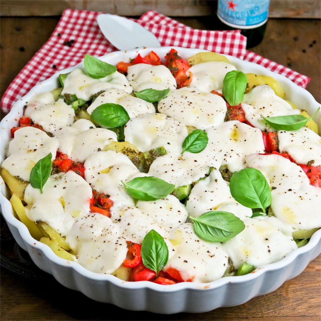 Mozzarella bake with bell peppers, tomatoes, potatoes and basil
