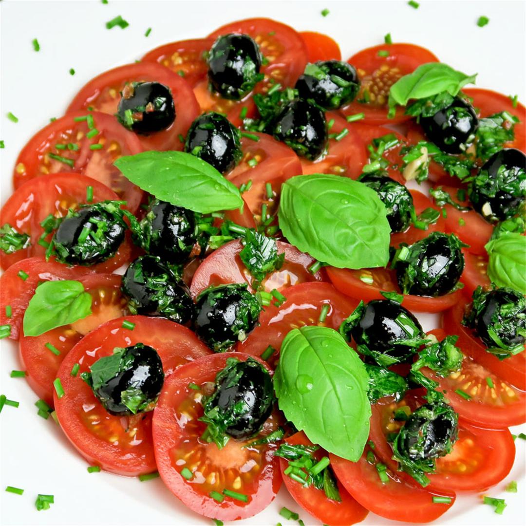 Mediterranean tomato salad with marinated olives and basil