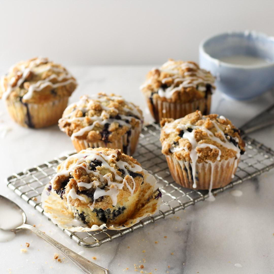Loaded blueberry muffins topped with brown sugar crumb streusel