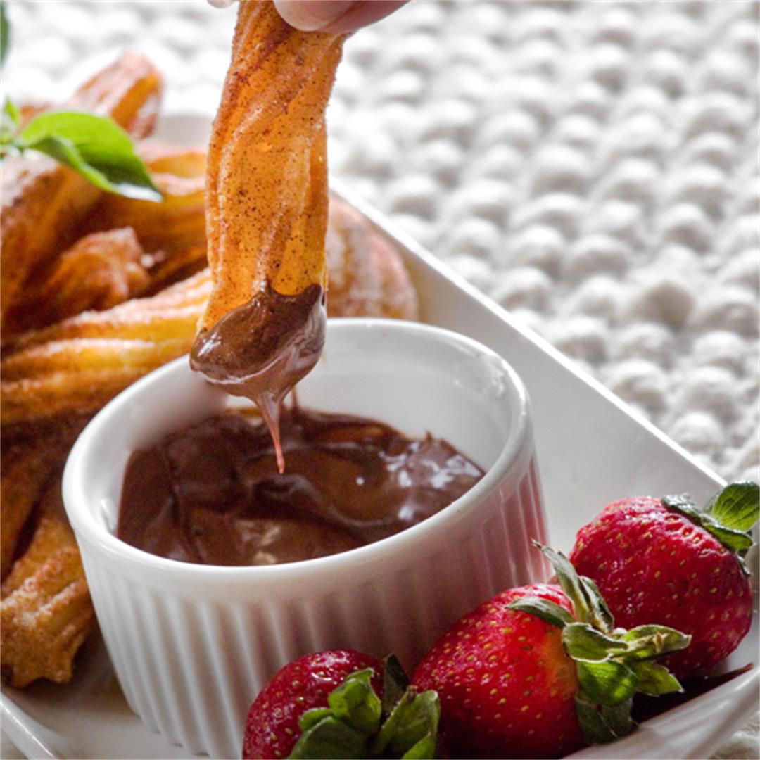 Churros with hot melted chocolate