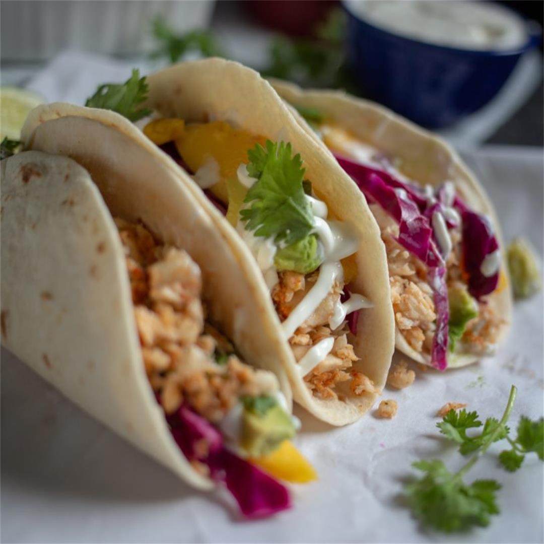 A recipe for fish tacos with lime crema: flaky tilapia, crunchy
