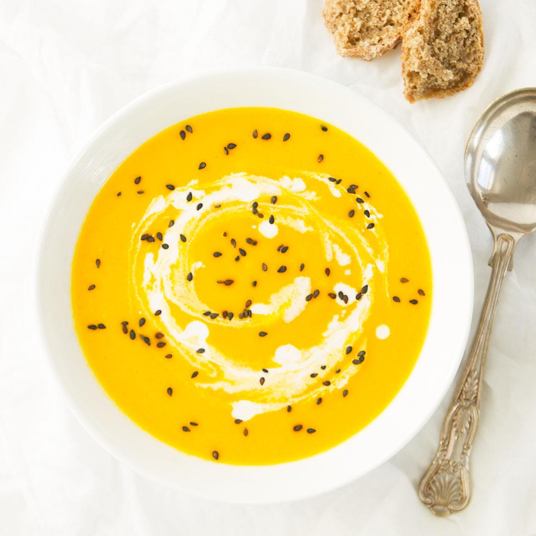 Creamy carrot and ginger soup with turmeric and coconut milk