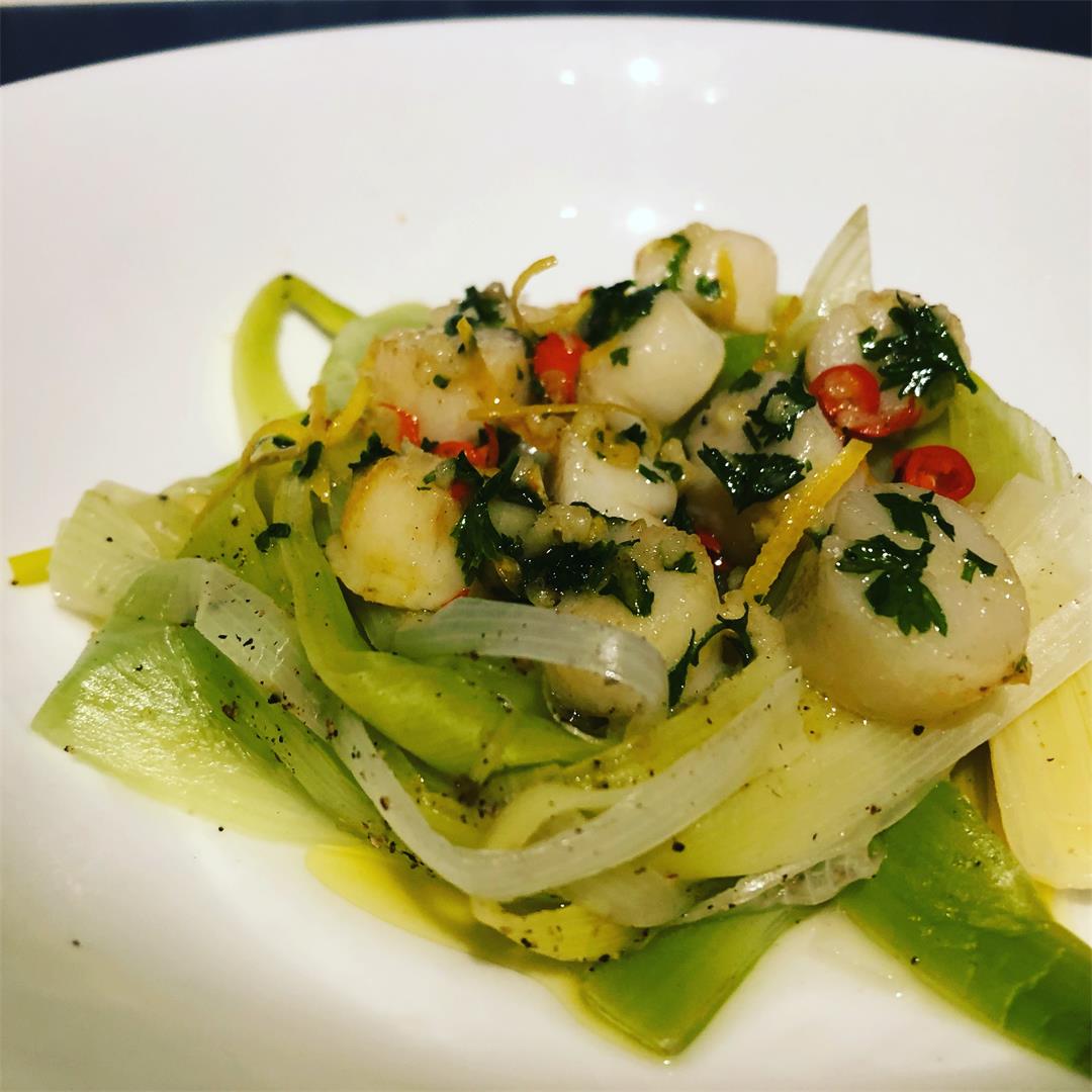 Scallops with chilli & lemon butter on a nest of leek