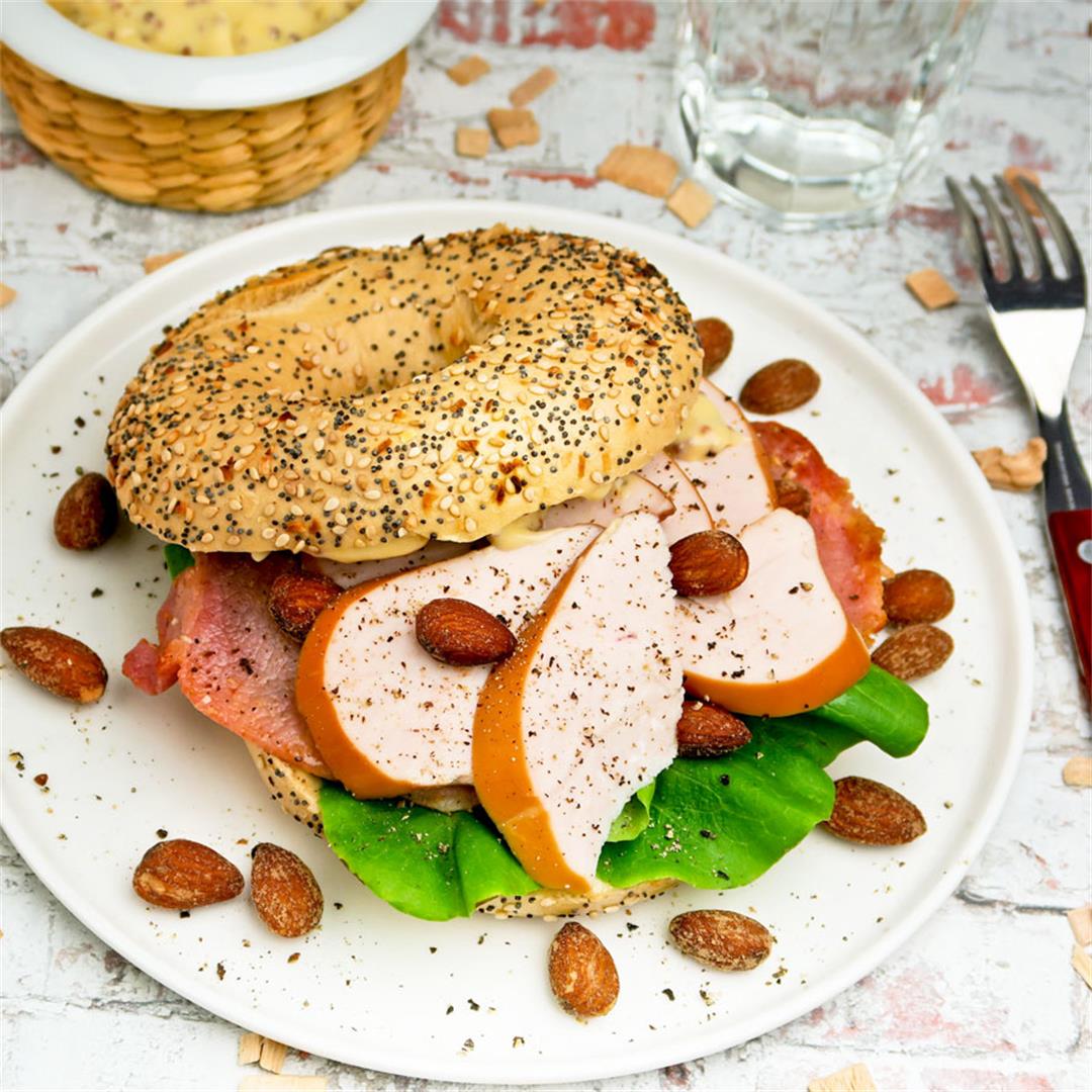 Bagel with smoked chicken, bacon, smoked almonds, honey mustard
