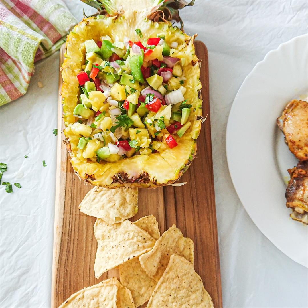 Pineapple avocado salsa served in a pineapple bowl