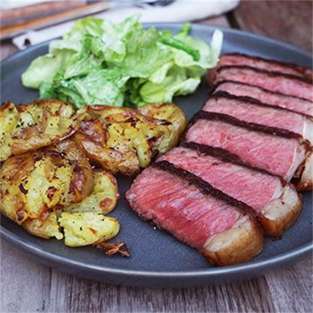 Seared Wagyu Strip Steak with Truffled Smashed Potatoes