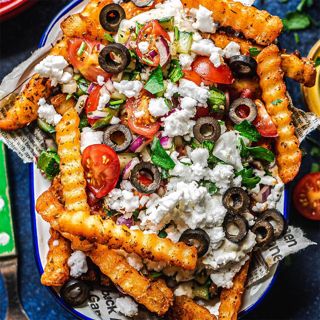 Greek loaded fries with vegan feta and marinated Greek salad
