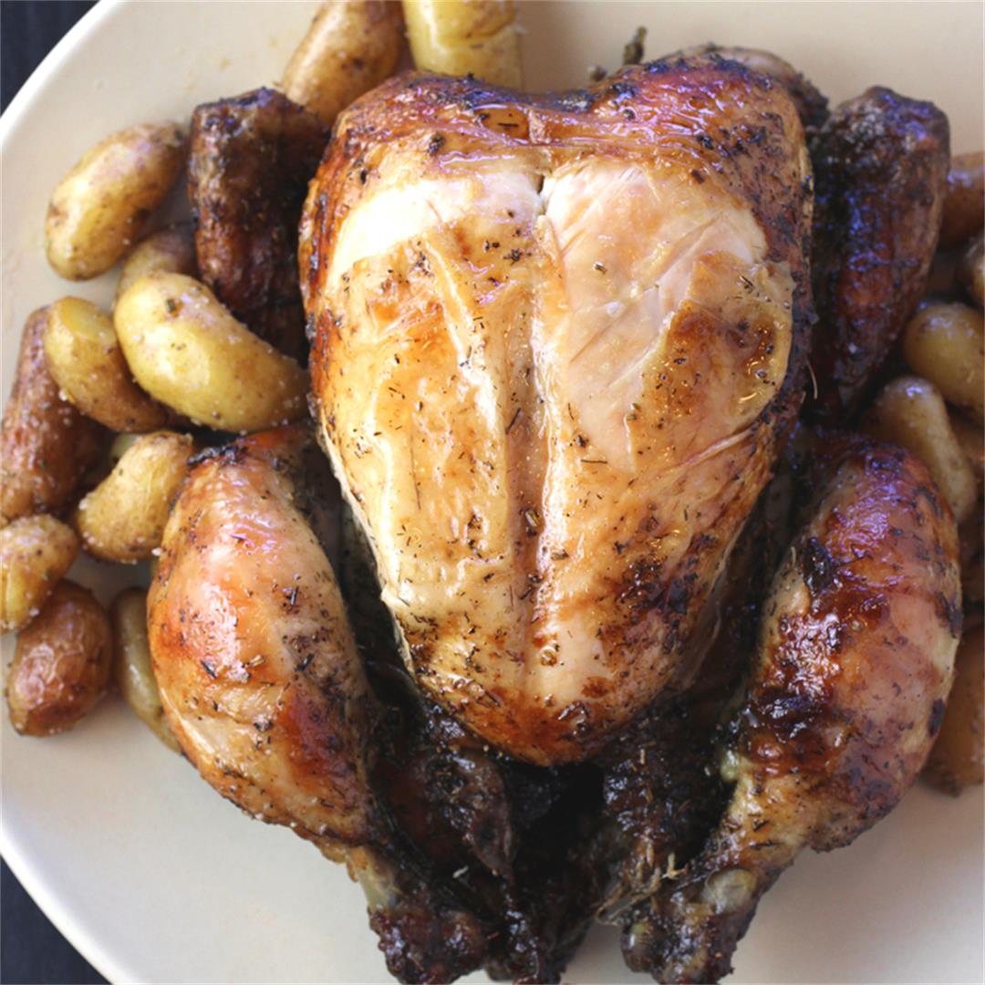 Roast chicken perfection with potatoes bathed in drippings