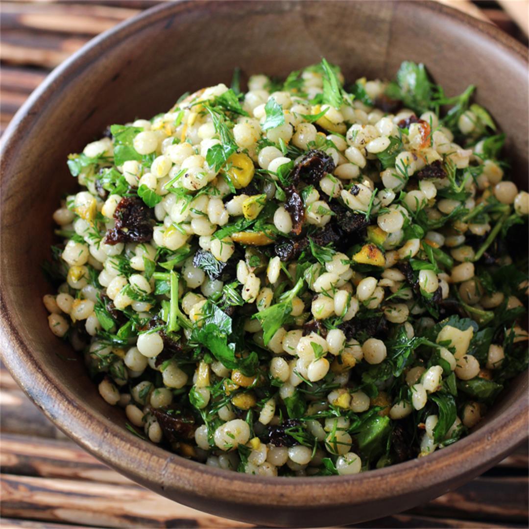 Spiced pearl couscous salad with pistachios, cumin, and prunes