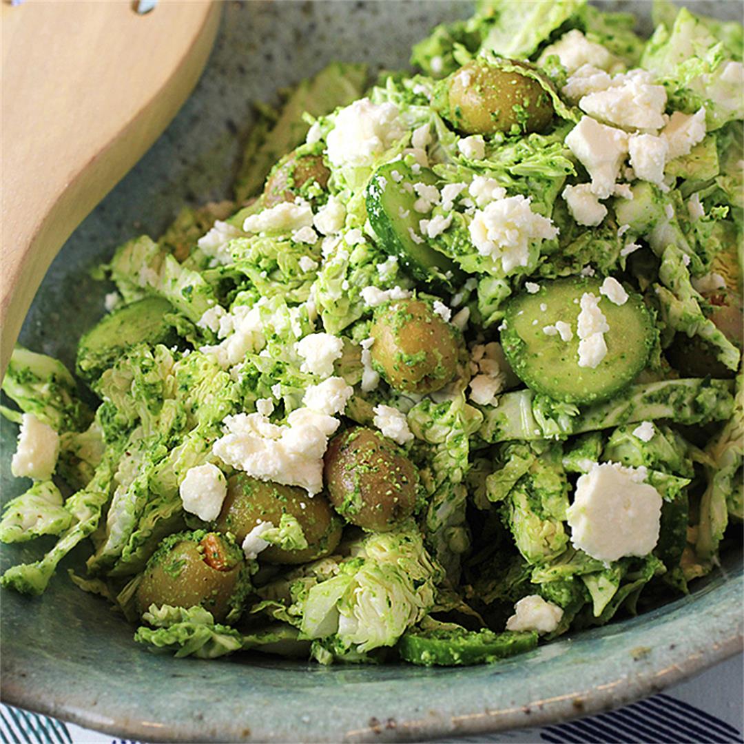 Polish cabbage salad in green sauce with olives