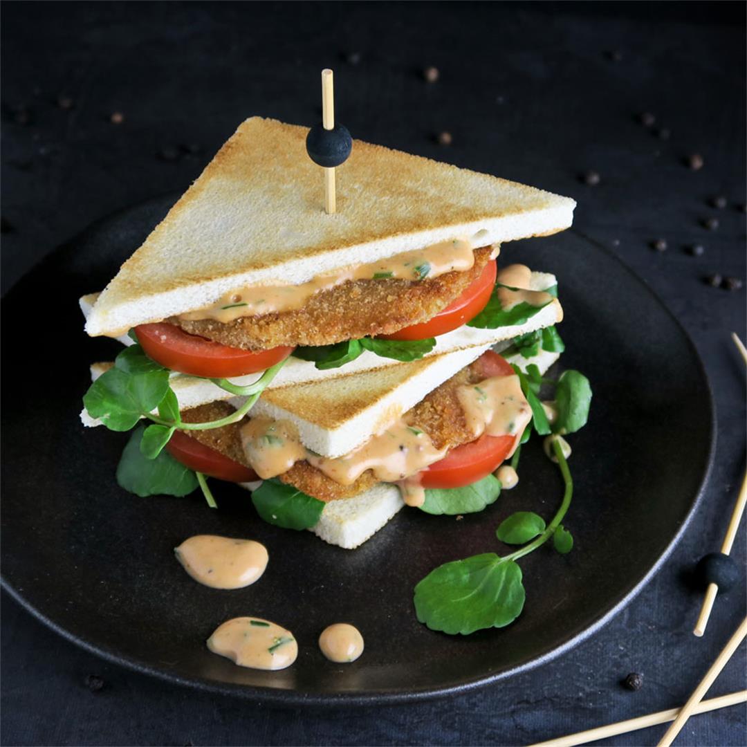 Milanesa sandwich with creamy salsa golf, watercress and tomato
