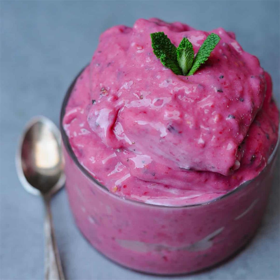 Vegan frozen yogurt with raspberries, peaches and mint