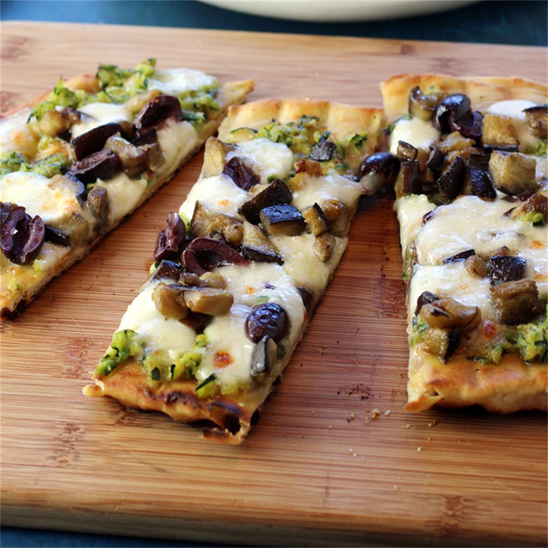 Grilled pizza with zucchini, eggplant, and olives