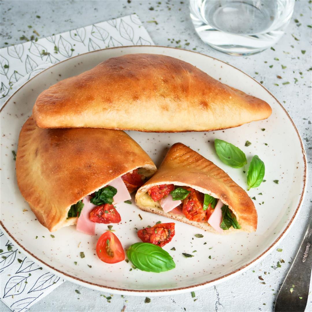 Mini calzones with mozzarella cheese, ham and sundried tomatoes