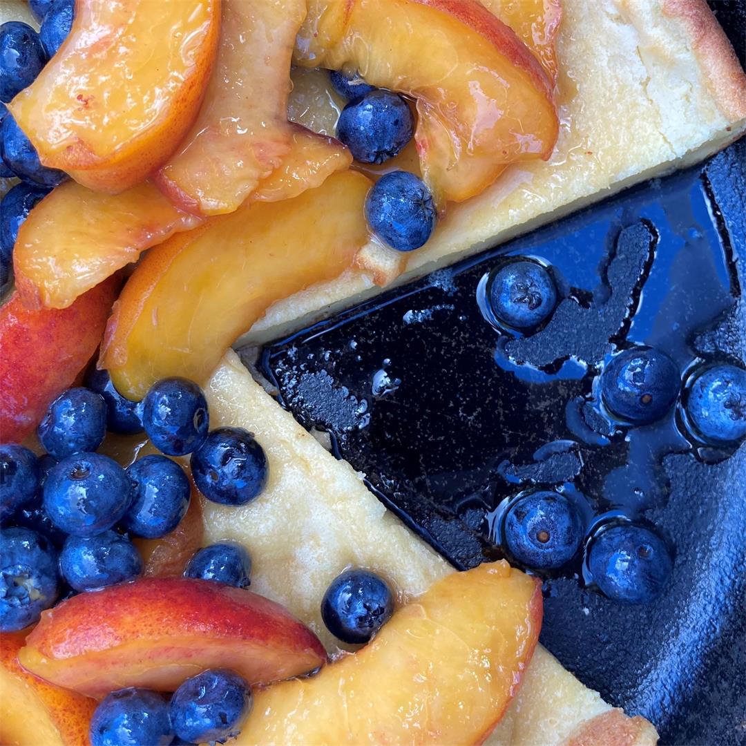 Dutch Baby with Maple-Glazed Peaches and Blueberries